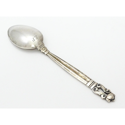 310 - A Georg Jensen silver teaspoon marked Sterling Denmark. Approx. 4 1/2