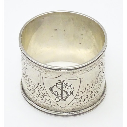 324 - A Victorian silver napkin ring engraved floral decoration. Hallmarked Sheffield 1900 maker Martin, H... 