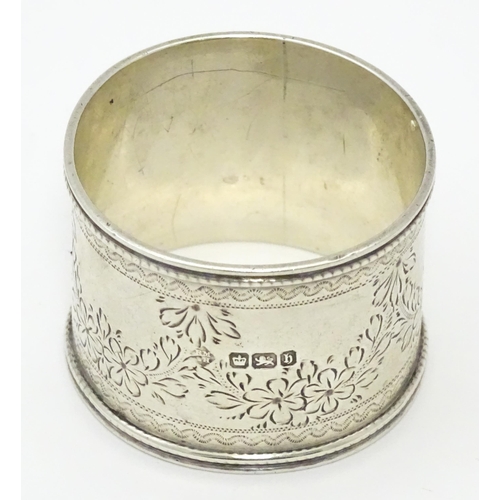 324 - A Victorian silver napkin ring engraved floral decoration. Hallmarked Sheffield 1900 maker Martin, H... 