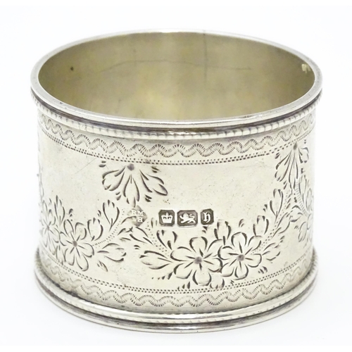 324 - A Victorian silver napkin ring engraved floral decoration. Hallmarked Sheffield 1900 maker Martin, H... 