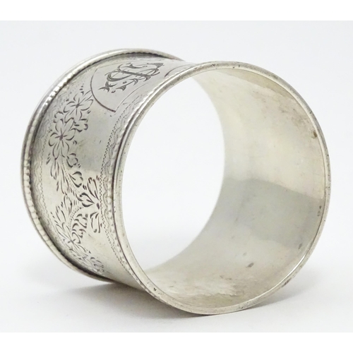 324 - A Victorian silver napkin ring engraved floral decoration. Hallmarked Sheffield 1900 maker Martin, H... 