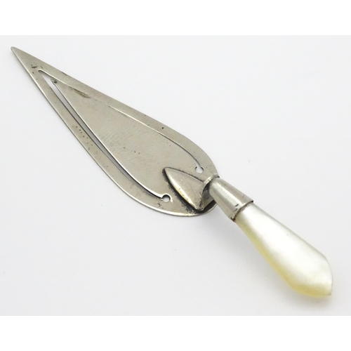 325 - A silver plate page marker formed as a stylised trowel with mother of pearl handle. Approx 3 1/2