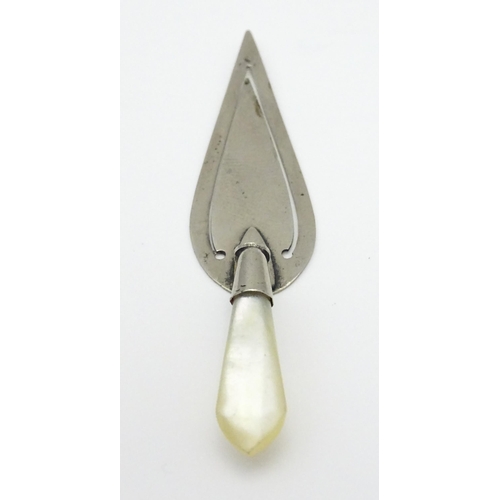 325 - A silver plate page marker formed as a stylised trowel with mother of pearl handle. Approx 3 1/2