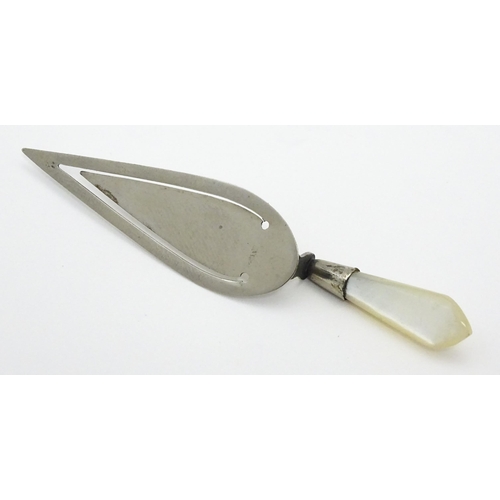 325 - A silver plate page marker formed as a stylised trowel with mother of pearl handle. Approx 3 1/2