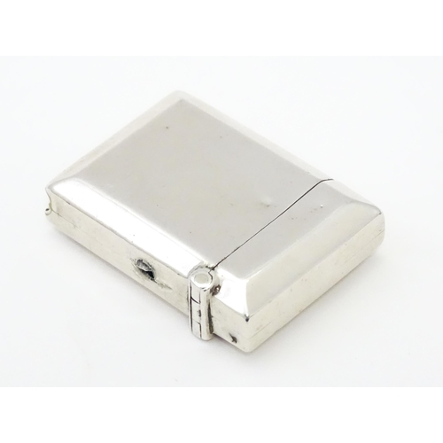 346 - A silver vesta case hallmarked Birmingham 1911 maker Rolason Brothers. Together with a silver napkin... 