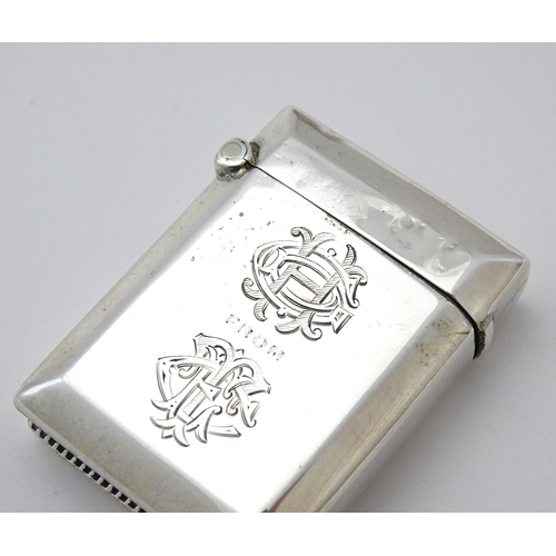 346 - A silver vesta case hallmarked Birmingham 1911 maker Rolason Brothers. Together with a silver napkin... 