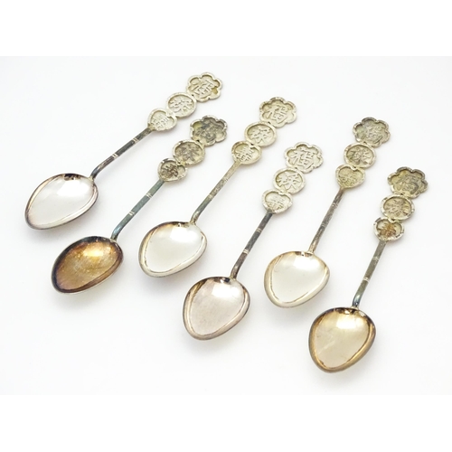 367 - A set of six Chinese export silver teaspoons with bamboo style handles decorated with Oriental chara... 