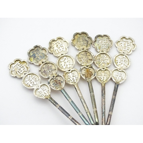 367 - A set of six Chinese export silver teaspoons with bamboo style handles decorated with Oriental chara... 