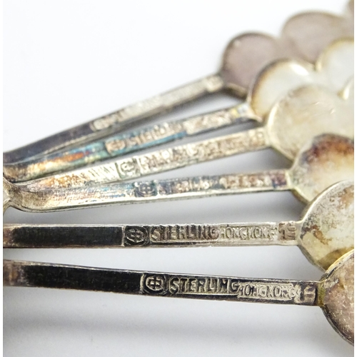 367 - A set of six Chinese export silver teaspoons with bamboo style handles decorated with Oriental chara... 