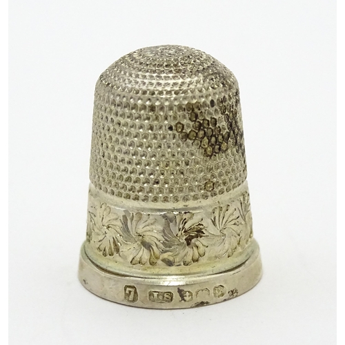 387 - Two silver thimbles, to include one hallmarked Birmingham 1912, maker James Swann (TW approx. 7.8g)(... 