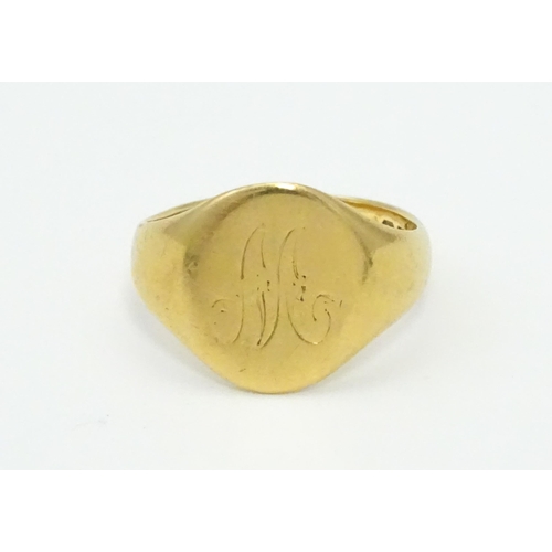 577 - An 18ct gold ring. Ring size approx. M 1/2 (Approx 6.9g)