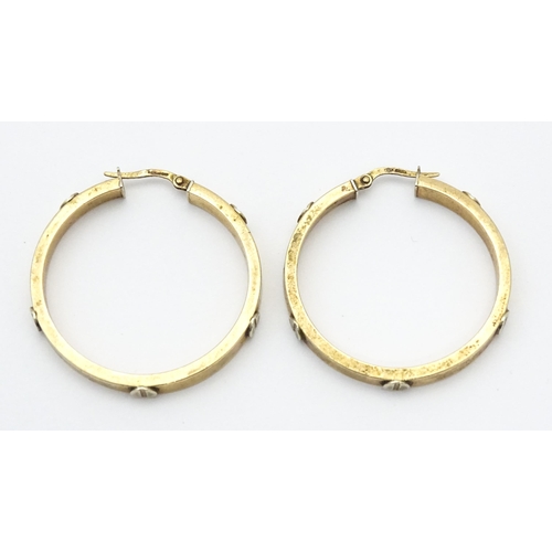 732 - A pair of 9ct gold hoop earrings. Approx. 1 1/4