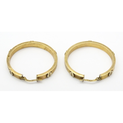 732 - A pair of 9ct gold hoop earrings. Approx. 1 1/4