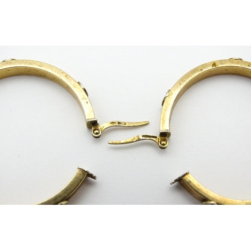 732 - A pair of 9ct gold hoop earrings. Approx. 1 1/4