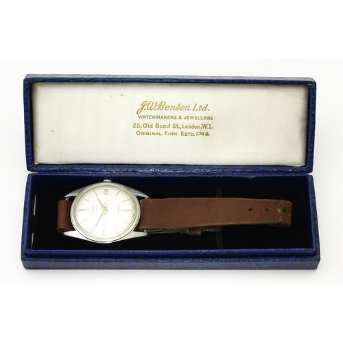 812 - A 1960s gentleman's wristwatch by J W Benson, the dial with hour batons and date aperture. With case... 