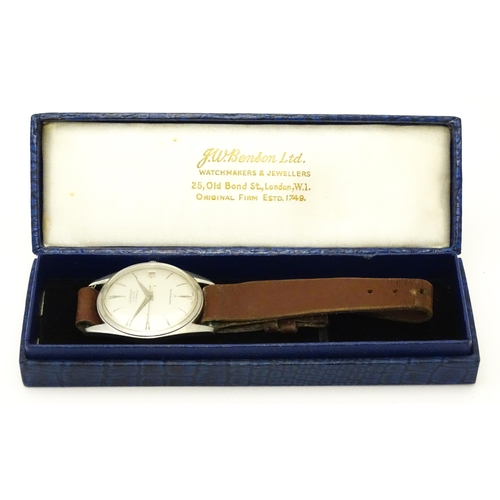 812 - A 1960s gentleman's wristwatch by J W Benson, the dial with hour batons and date aperture. With case... 