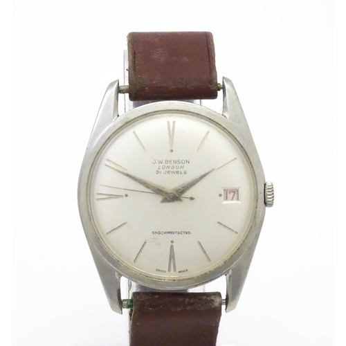 812 - A 1960s gentleman's wristwatch by J W Benson, the dial with hour batons and date aperture. With case... 