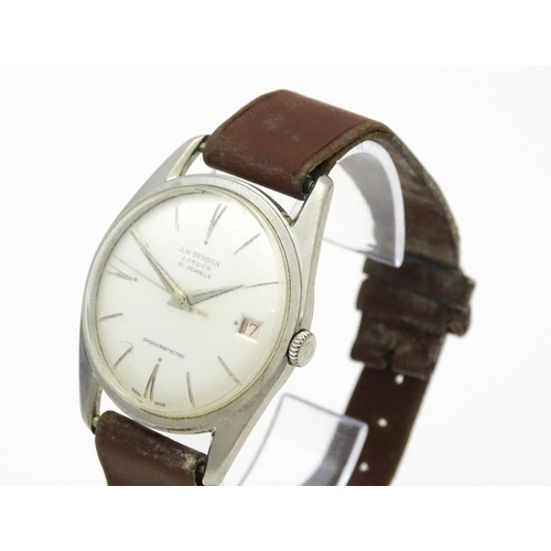 812 - A 1960s gentleman's wristwatch by J W Benson, the dial with hour batons and date aperture. With case... 