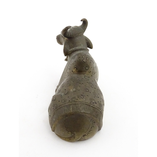 1049 - Three assorted items to include an Indian cast brass Nandi idol modelled as a recumbent bull with st... 