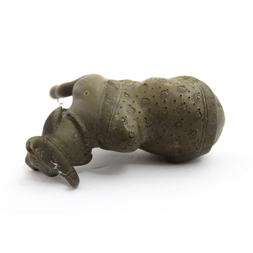 1049 - Three assorted items to include an Indian cast brass Nandi idol modelled as a recumbent bull with st... 