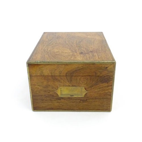 1066 - A Victorian walnut jewellery box / vanity case with inlaid brass stringing, campaign style handle an... 