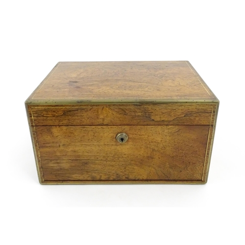 1066 - A Victorian walnut jewellery box / vanity case with inlaid brass stringing, campaign style handle an... 