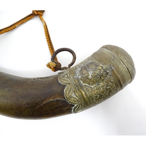 1070 - A 19thC Eastern powder flask, constructed from ox horn with decorative brass mounts and a weaved lan... 