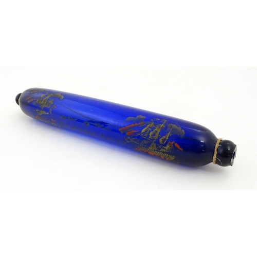 1088 - Naval Interest: A 19thC Bristol blue glass rolling pin bearing the motto 'Love & Live Happy' with sh... 