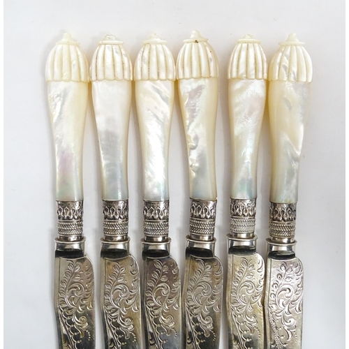 1090 - A cased set of silver plate fish eaters with mother of pearl handles and silver collars. Case approx... 