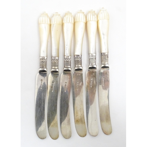 1090 - A cased set of silver plate fish eaters with mother of pearl handles and silver collars. Case approx... 