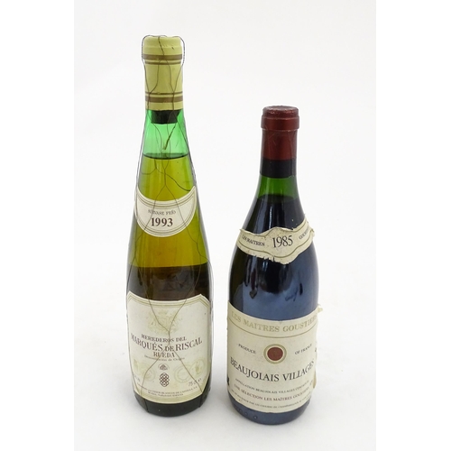 1093 - A 70cl bottle of Les Maitres Goustiers Beaujolais Villages 1985 red wine, together with a 75cl bottl... 