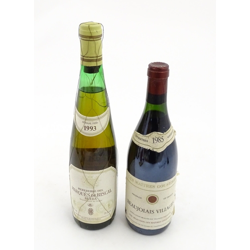 1093 - A 70cl bottle of Les Maitres Goustiers Beaujolais Villages 1985 red wine, together with a 75cl bottl... 