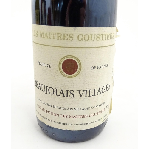 1093 - A 70cl bottle of Les Maitres Goustiers Beaujolais Villages 1985 red wine, together with a 75cl bottl... 