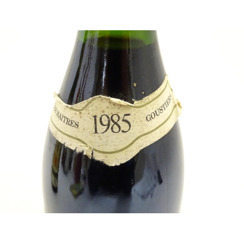 1093 - A 70cl bottle of Les Maitres Goustiers Beaujolais Villages 1985 red wine, together with a 75cl bottl... 