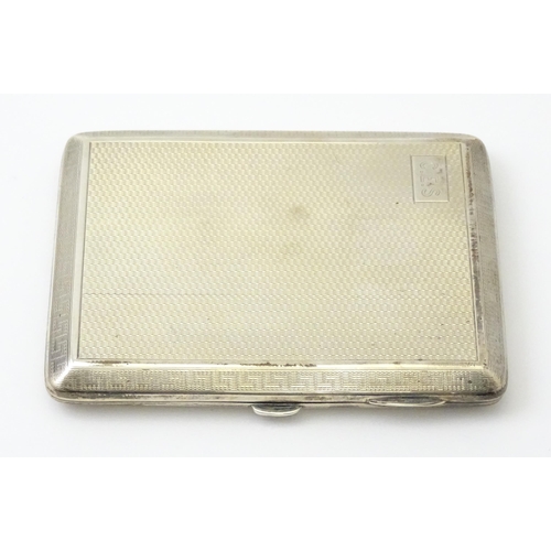 240 - A silver card case  with engine turned decoration  and Greek key borders. Hallmarked Birmingham 1928... 