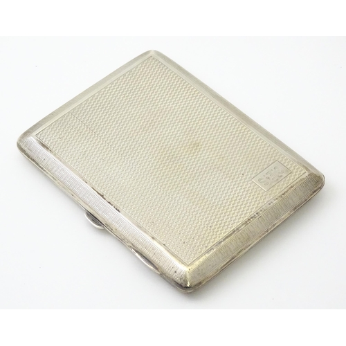 240 - A silver card case  with engine turned decoration  and Greek key borders. Hallmarked Birmingham 1928... 