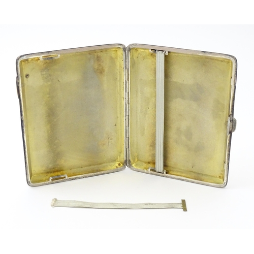 240 - A silver card case  with engine turned decoration  and Greek key borders. Hallmarked Birmingham 1928... 