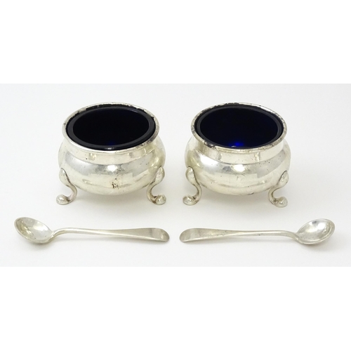 249 - A pair of Canadian Birks Sterling silver salts and matching spoons. Salts approx 2