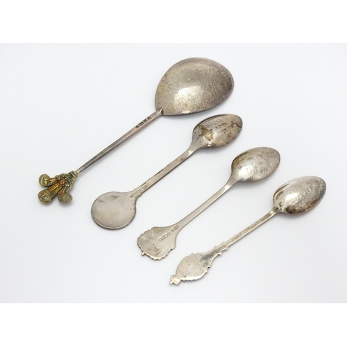 254 - 4 Various souvenir / commemorative spoons to include one with gilt fleur de ley decoration to handle... 