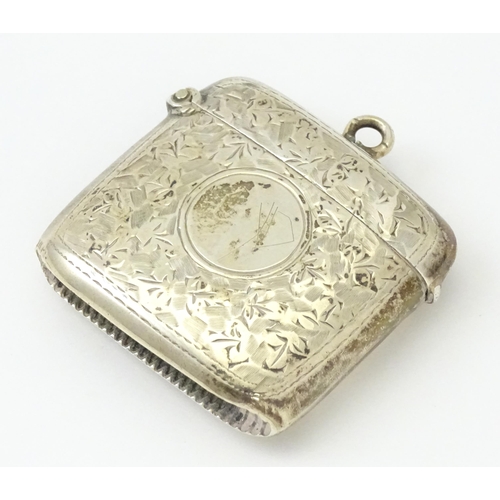 272 - A silver vesta case with engraved foliate decoration.  Hallmarked Birmingham 1909, maker Samuel M Le... 