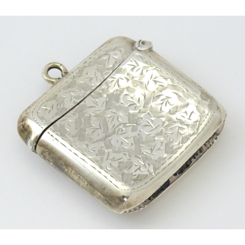 272 - A silver vesta case with engraved foliate decoration.  Hallmarked Birmingham 1909, maker Samuel M Le... 