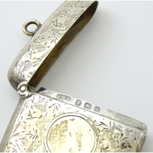 272 - A silver vesta case with engraved foliate decoration.  Hallmarked Birmingham 1909, maker Samuel M Le... 