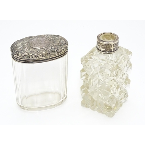 284 - A cut glass scent / perfume flask with silver mounts hallmarked London 1901.  Together with a panel ... 