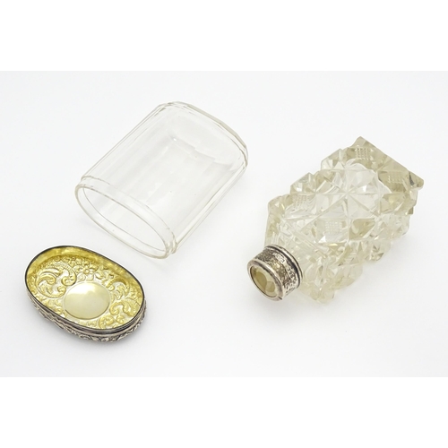 284 - A cut glass scent / perfume flask with silver mounts hallmarked London 1901.  Together with a panel ... 