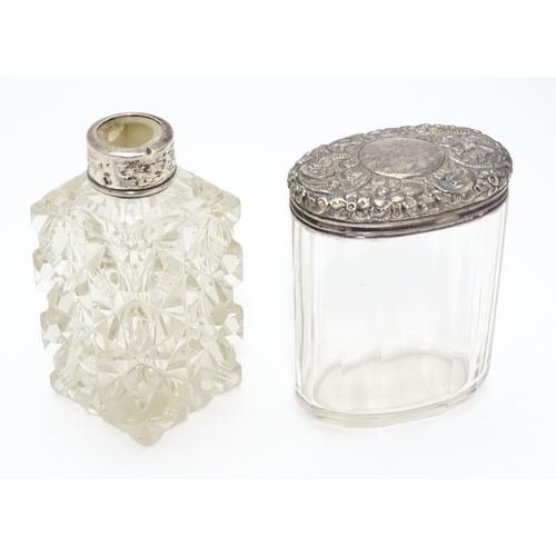 284 - A cut glass scent / perfume flask with silver mounts hallmarked London 1901.  Together with a panel ... 