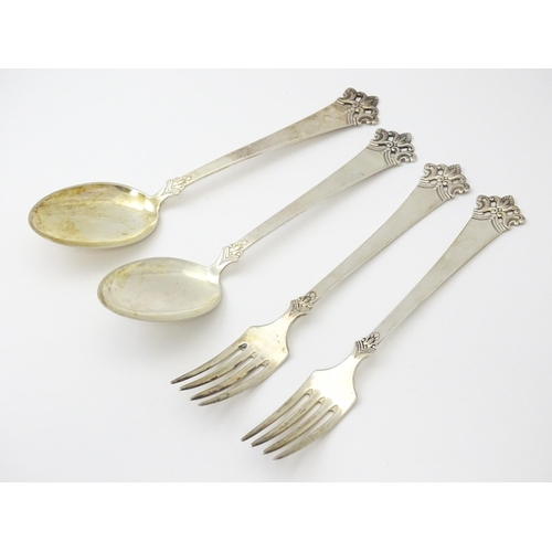 306 - Scandinavian silver : A pair of Norwegian .830 silver spoons and forks by Magnus Aase of Bergen Norw... 