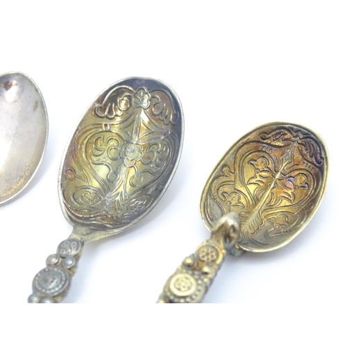 409 - Five assorted hallmarked silver spoons to include two silver gilt examples modelled as anointing spo... 