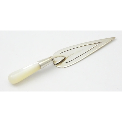 448 - A silver page marker of trowel form with mother of pearl handle, hallmarked London 1985, maker Ari D... 