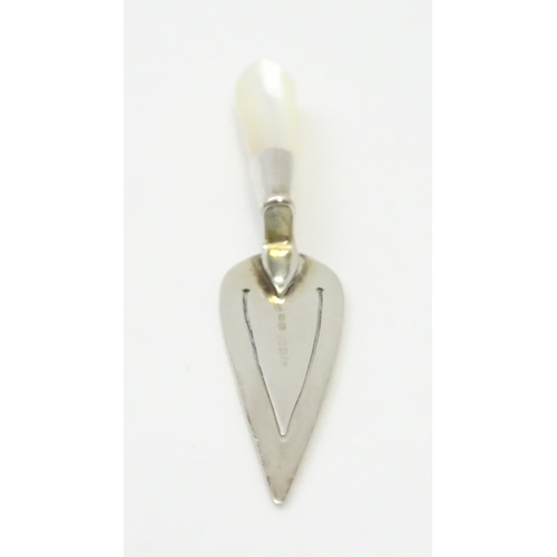 448 - A silver page marker of trowel form with mother of pearl handle, hallmarked London 1985, maker Ari D... 