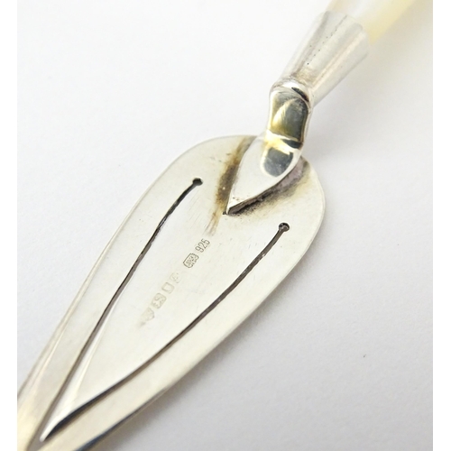 448 - A silver page marker of trowel form with mother of pearl handle, hallmarked London 1985, maker Ari D... 